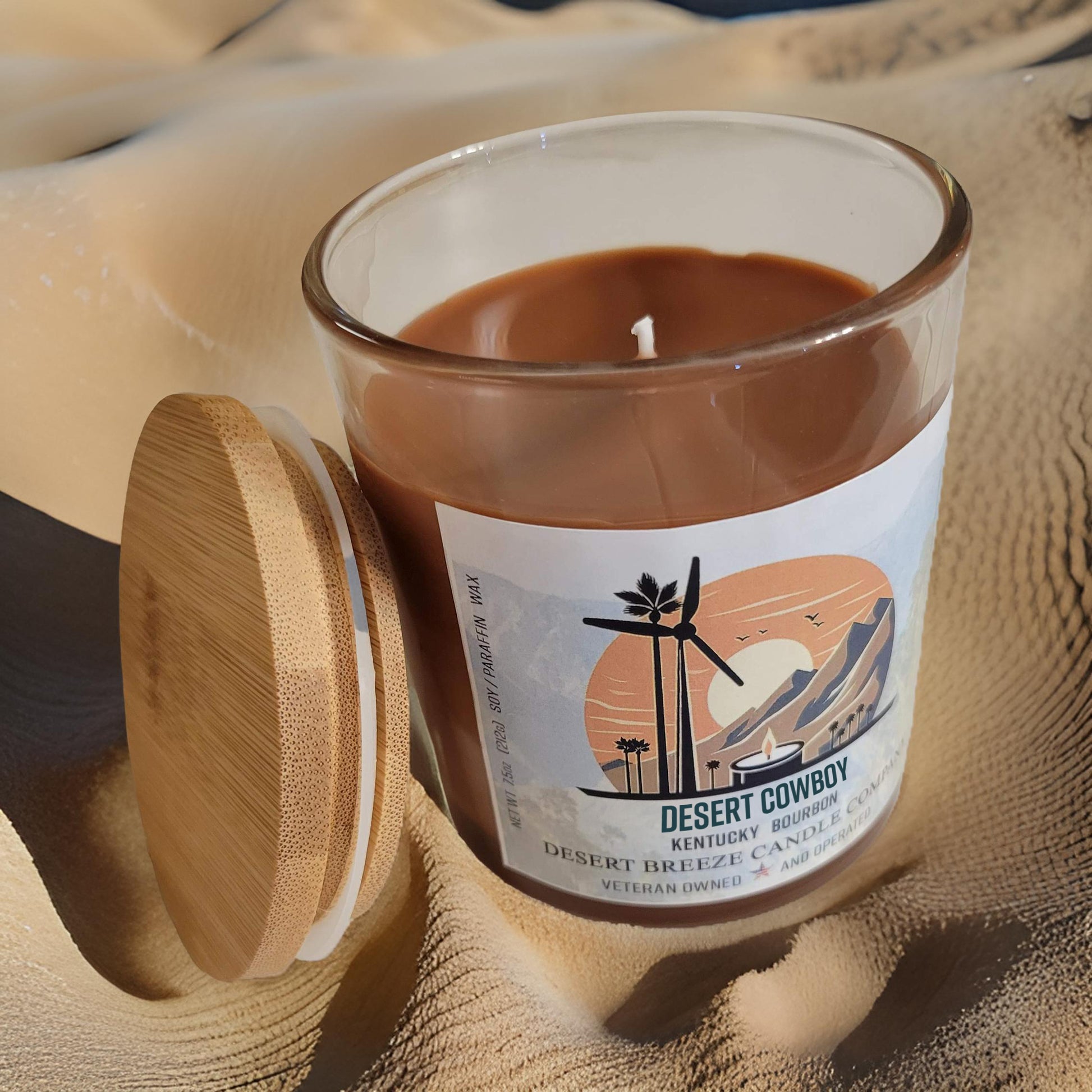 Desert Cowboy Candle sitting on sand