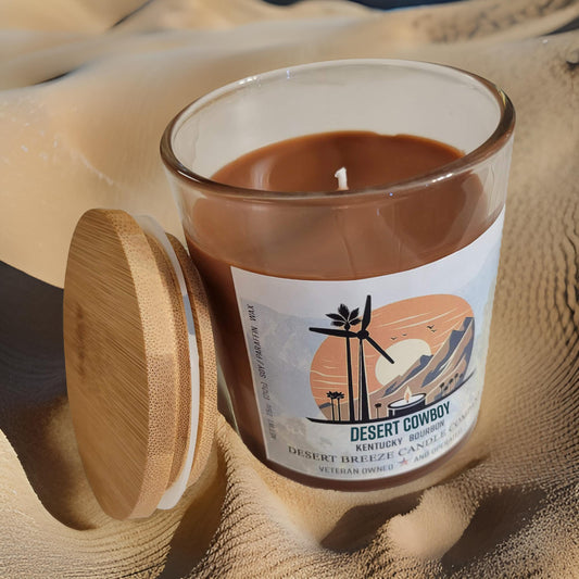 Desert Cowboy Candle sitting on sand